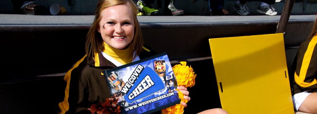 Cheerleader holding a book